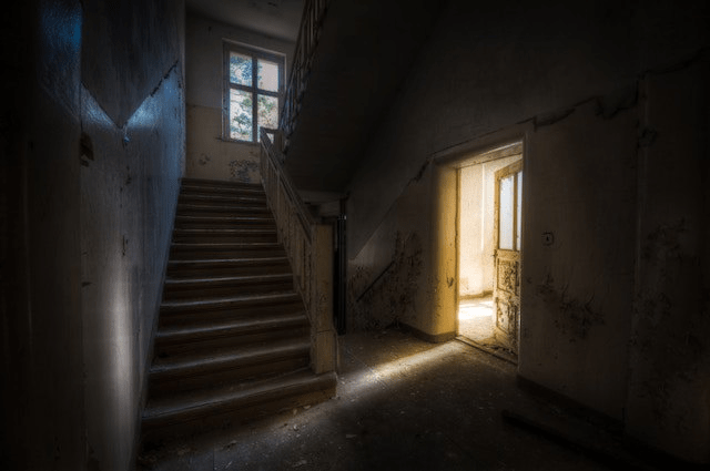Stairwell-in-an-abandoned-house-shadows-and-light