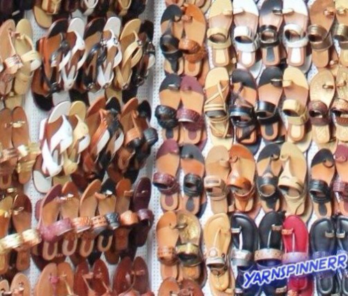 walls-of-mismatched-shoes-sandals-on-peg-board 