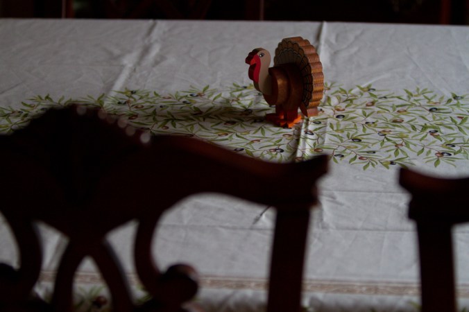 turkey-figure-siting-alone-on-a-dining-room-table