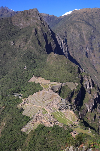 Rare and full view of ancient ruins of Machu Picchu in Peru from high above. Cloudless.
